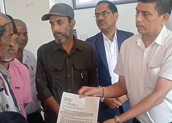 Santosh Subedi, coordinator of 'Bachna De Sarkar', hands over a memorandum to Chief District Officer Shivlal Gelal, accompanied by Ranabahadur Officer and Balak Simrik Chaudhary, inside the district administration office in Chandranagar, Jhapa.